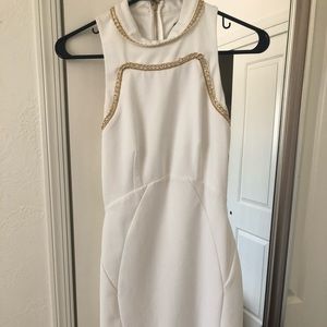 Formal white dress with gold accents